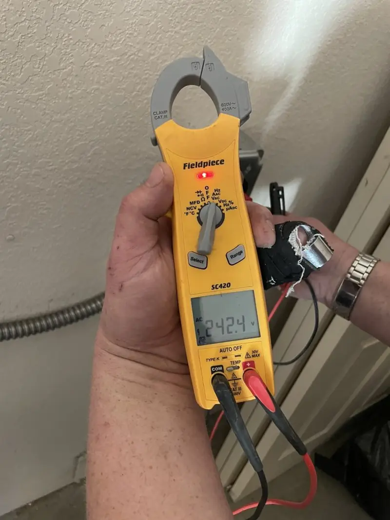Voltage testing with clamp meter during Electrical Installation Services in El Cajon